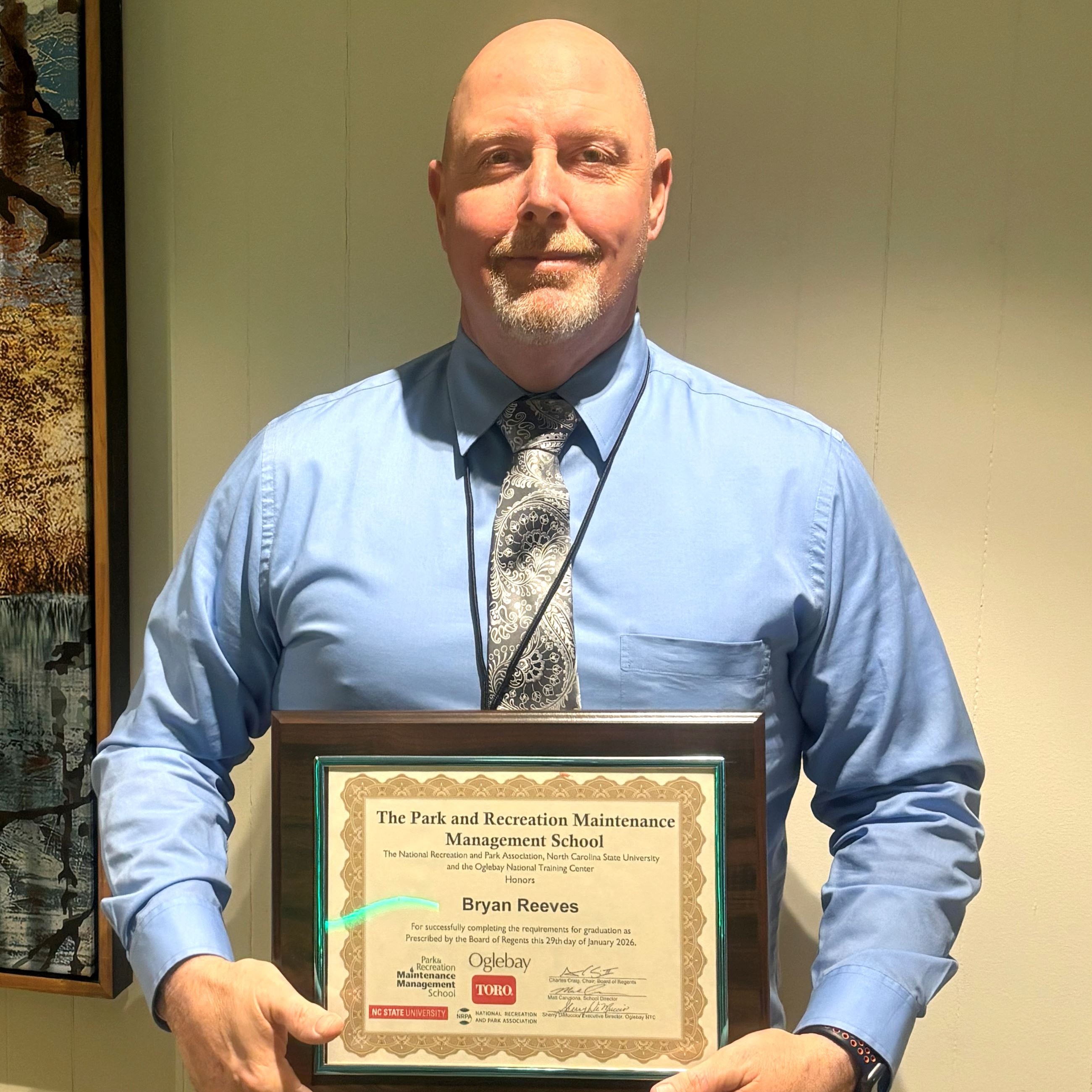 Bryan Reeves with plaque